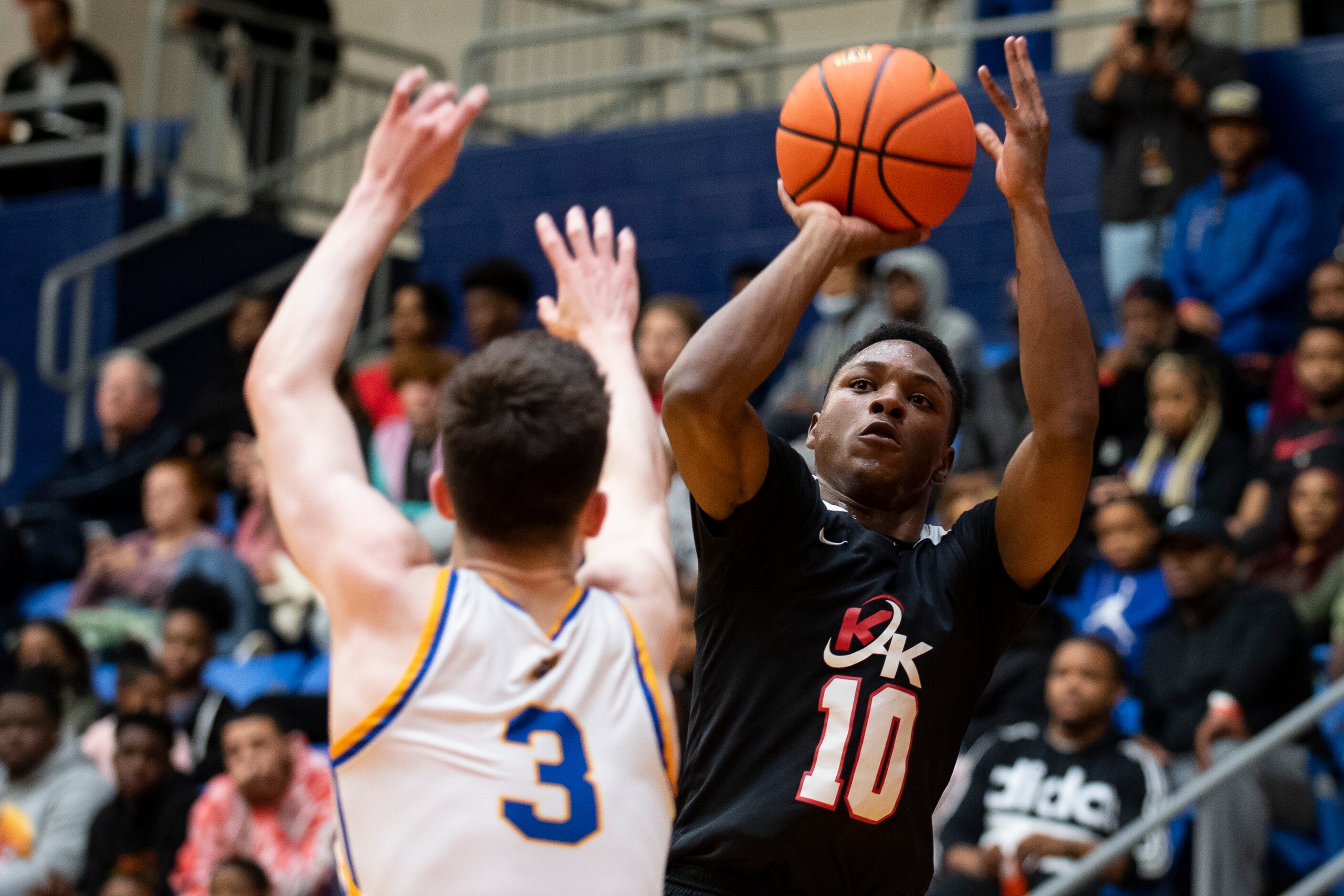 Kimball senior Trey Clayton (10) goes up for a shot over North Little Rock junior Ty...