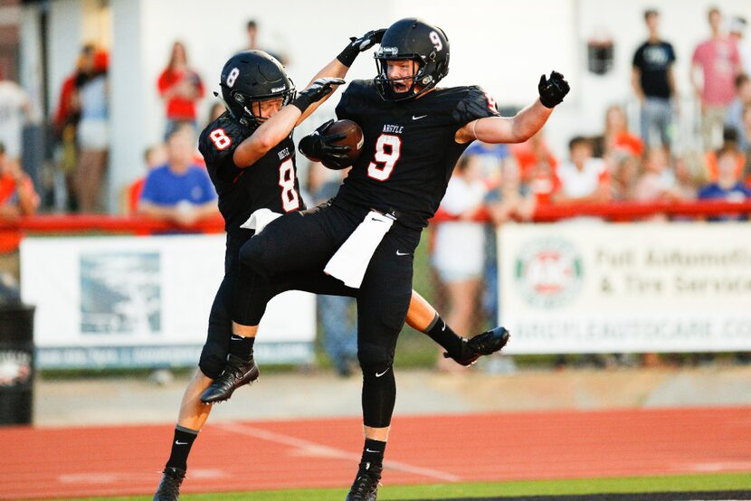 Argyle junior wide receiver Chase Estrada (9) scores a touchdown and celebrates with...