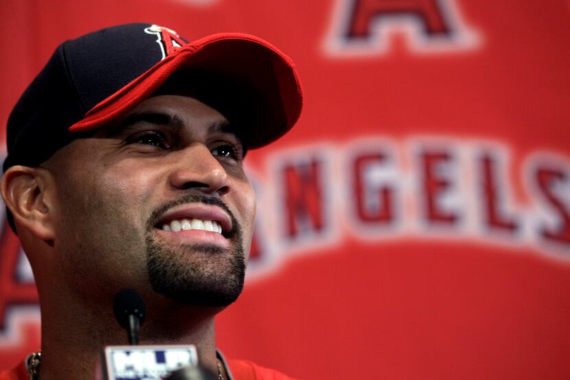 Albert Pujols, a three-time National League MVP, has a new, 10-year contract worth $240...