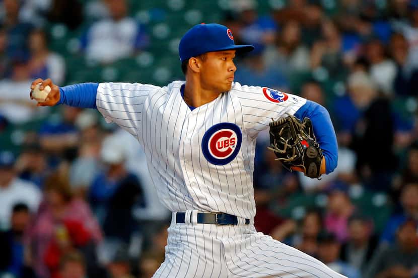 CHICAGO, IL - MAY 08:  Jen-Ho Tseng #52 of the Chicago Cubs pitches against the Miami...