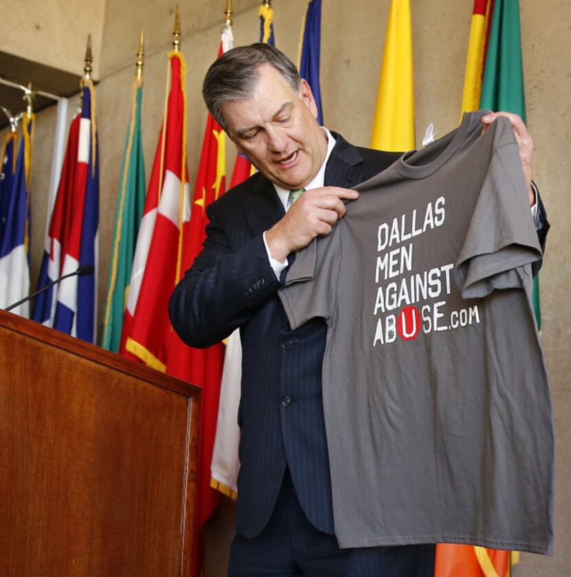 Dallas Mayor Mike Rawlings showed off the official shirt during his announcment detailing...