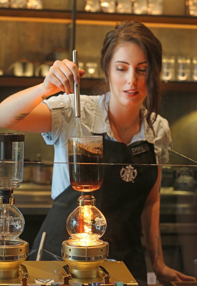 Emmi Lumkes brews coffee at the Starbucks Reserve bar at the McKinney & Olive high-rise in...