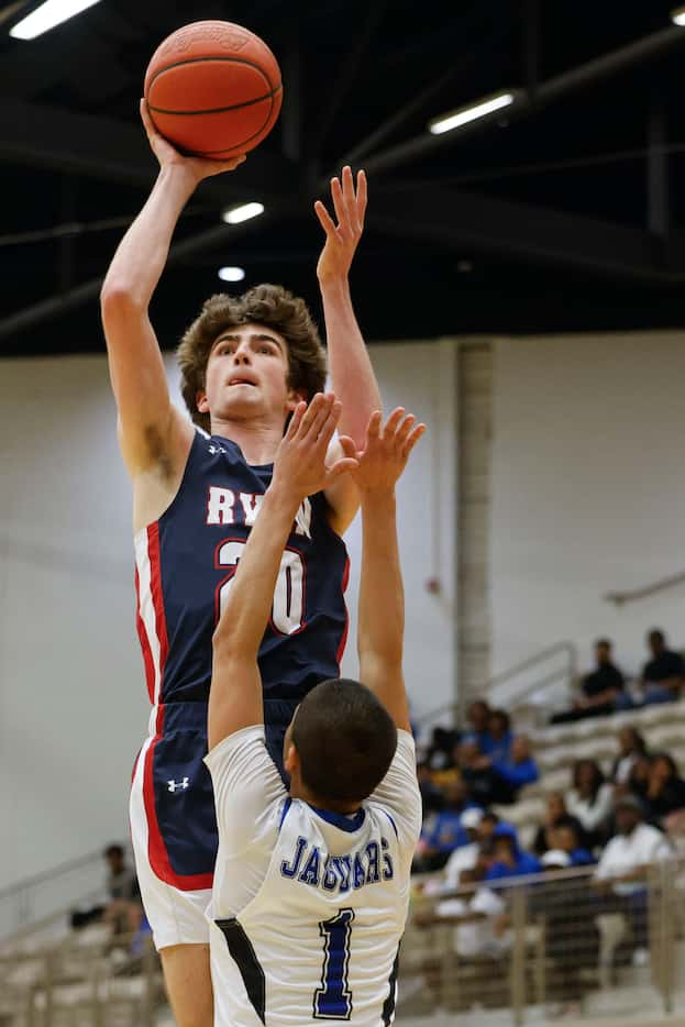 Denton Ryan’s Matthew Carter (back) shoots over Mansfield Summit’s Theo Brannan during the...