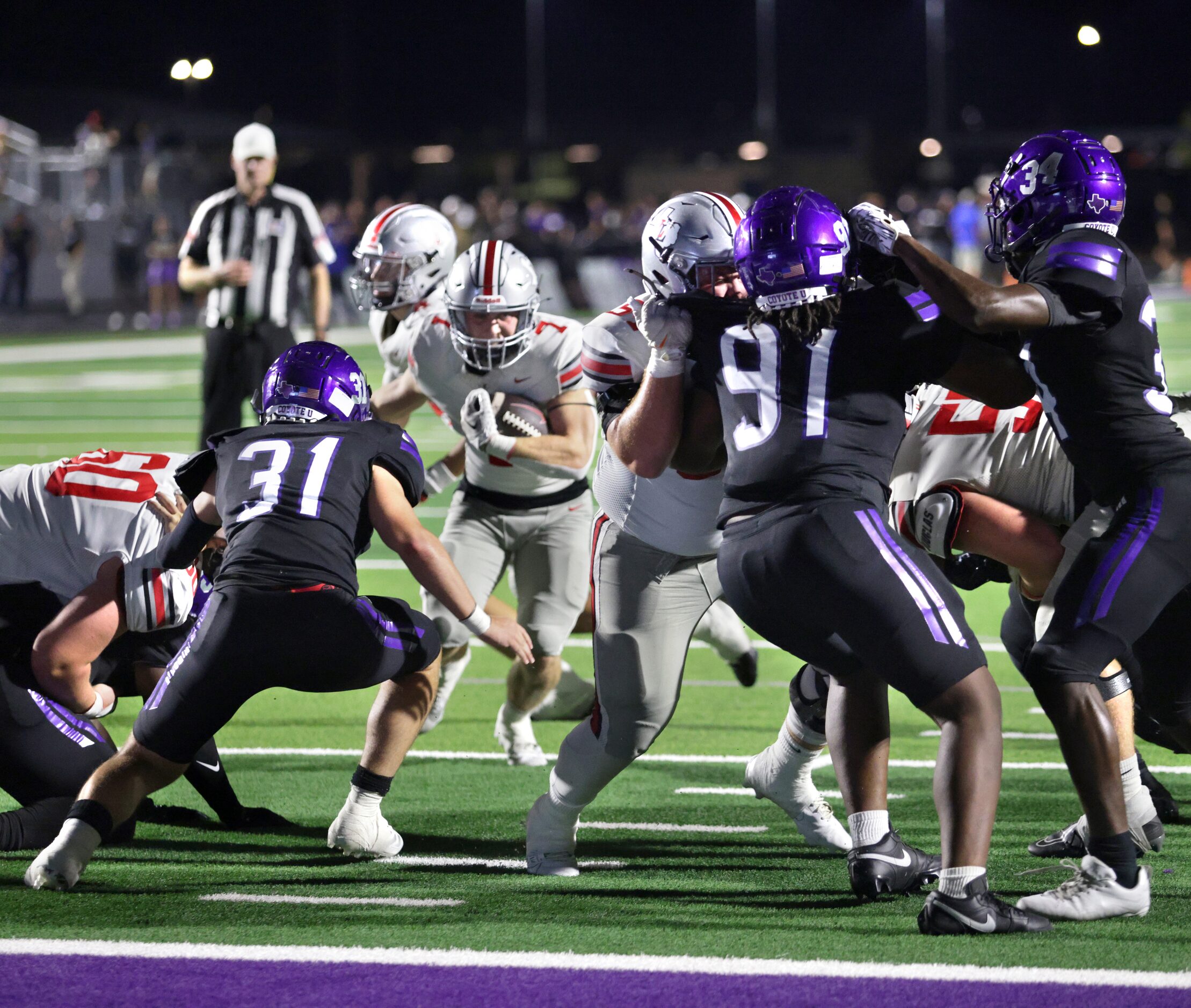 Lovejoy player #7 Ben Adams looks for a pocket during the Lovejoy High School at Anna High...