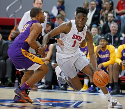 FILE - SMU guard Shake Milton (1) drives the ball around Albany guard David Nichols (13)...