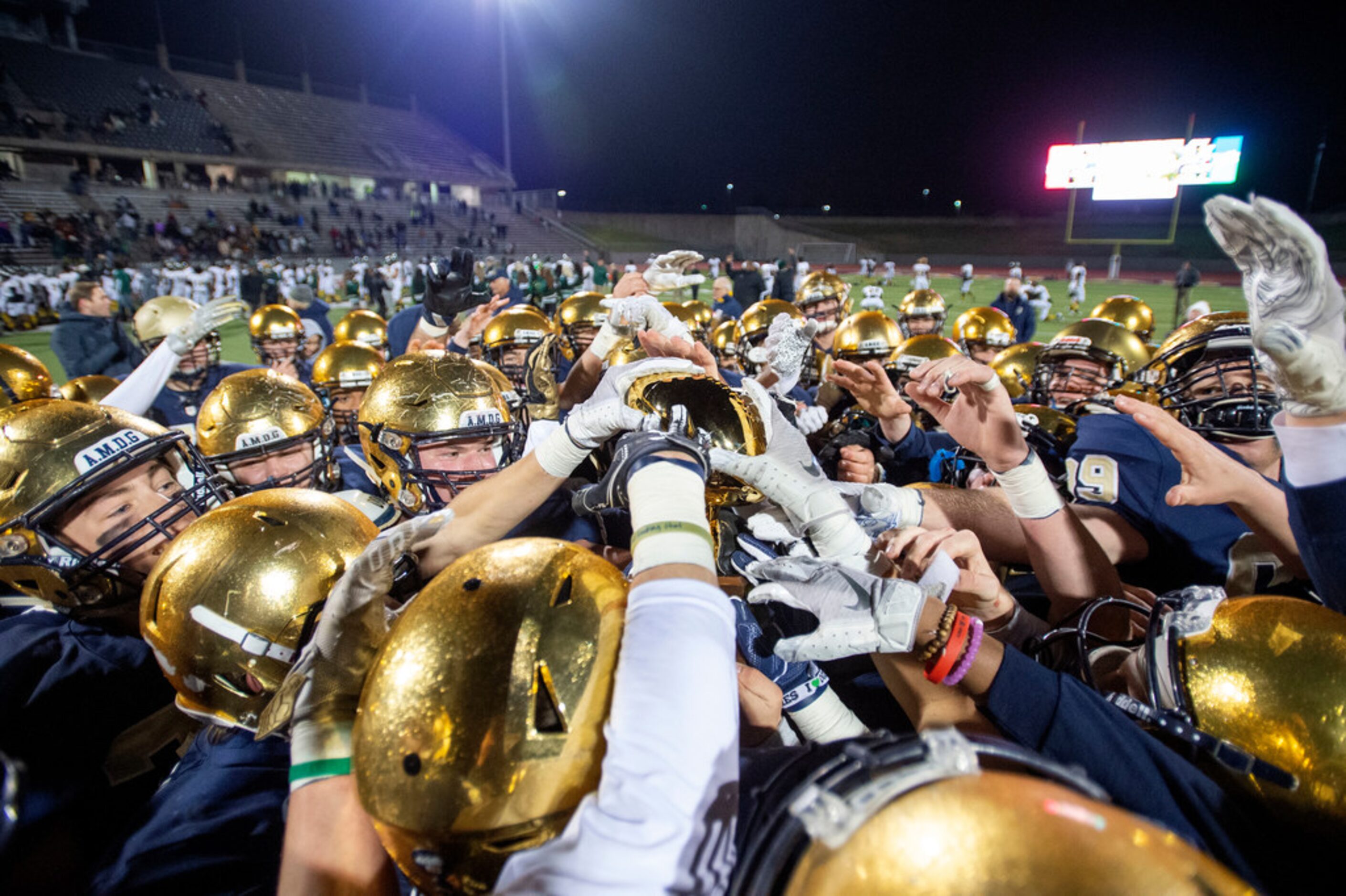 The Jesuit Rangers celebrate their 27-25 victory over defending state champions Longview in...