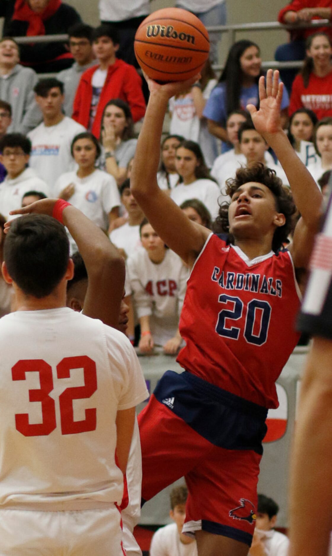 Plano John Paul ll guard Jaylon Tyson (20) sinks an off-balance jumper over the defense of...