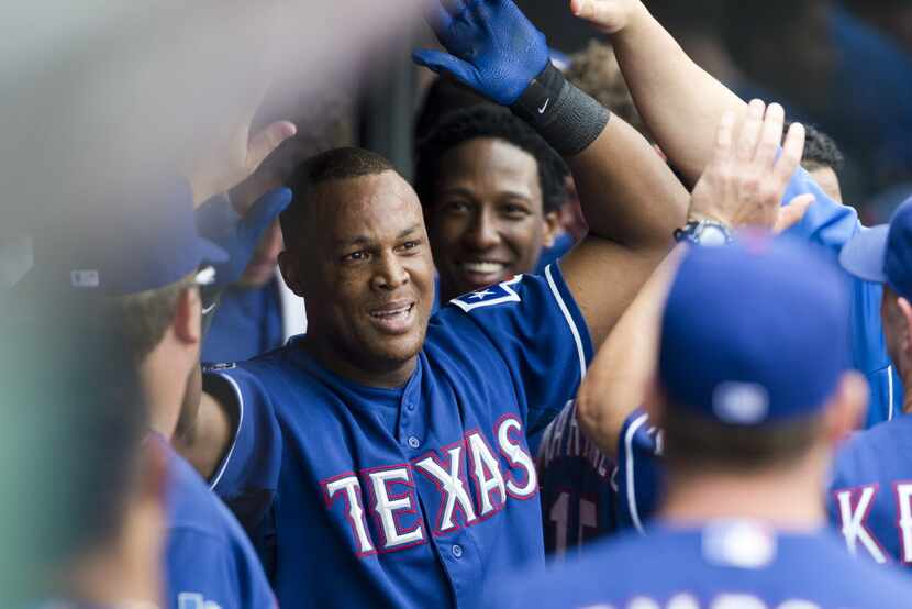 CLEVELAND, OH - SEPTEMBER 2: Adrian Beltre #29 of the Texas Rangers celebrates in the dugout...