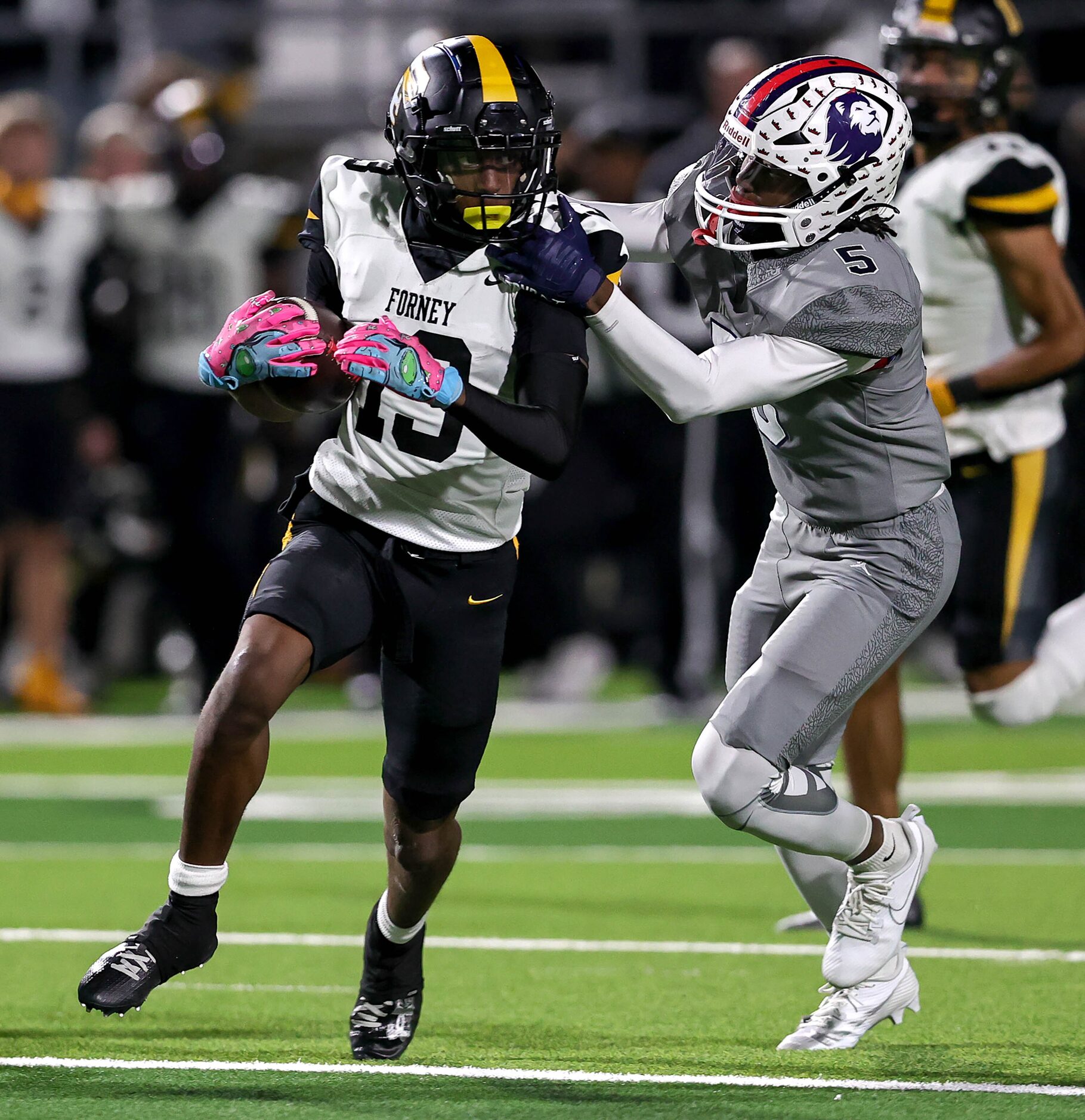 Forney kick returner Imari Jehiel (13) makes a nice gain on a kickoff return against...