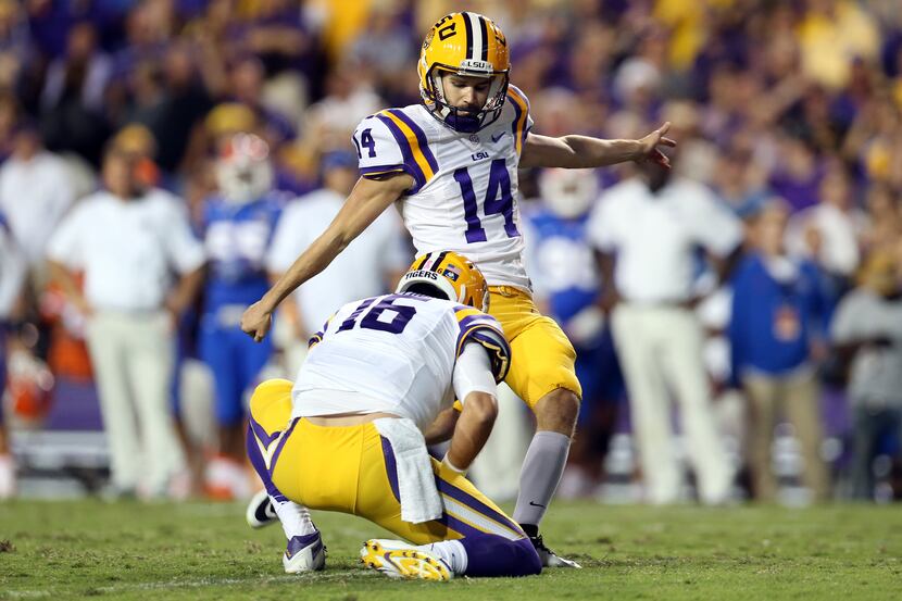BATON ROUGE, LA - OCTOBER 17:  Trent Domingue #14 of the LSU Tigers kicks an extra point...