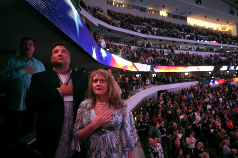 Dallas Stars owner Tom Gaglardi, with his cousin, Kellie Serault from Fort Worth, listened...