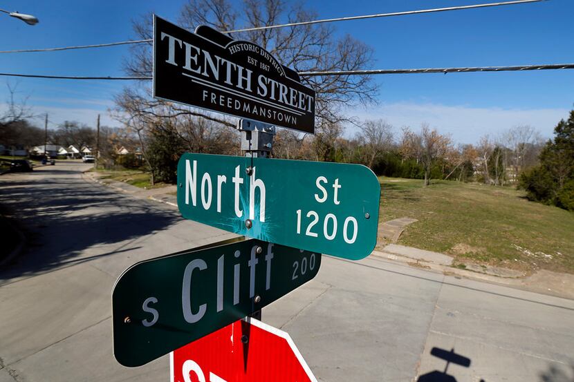 A street sign topper reminds residents of the historic Tenth Street Freedmanstown east of...