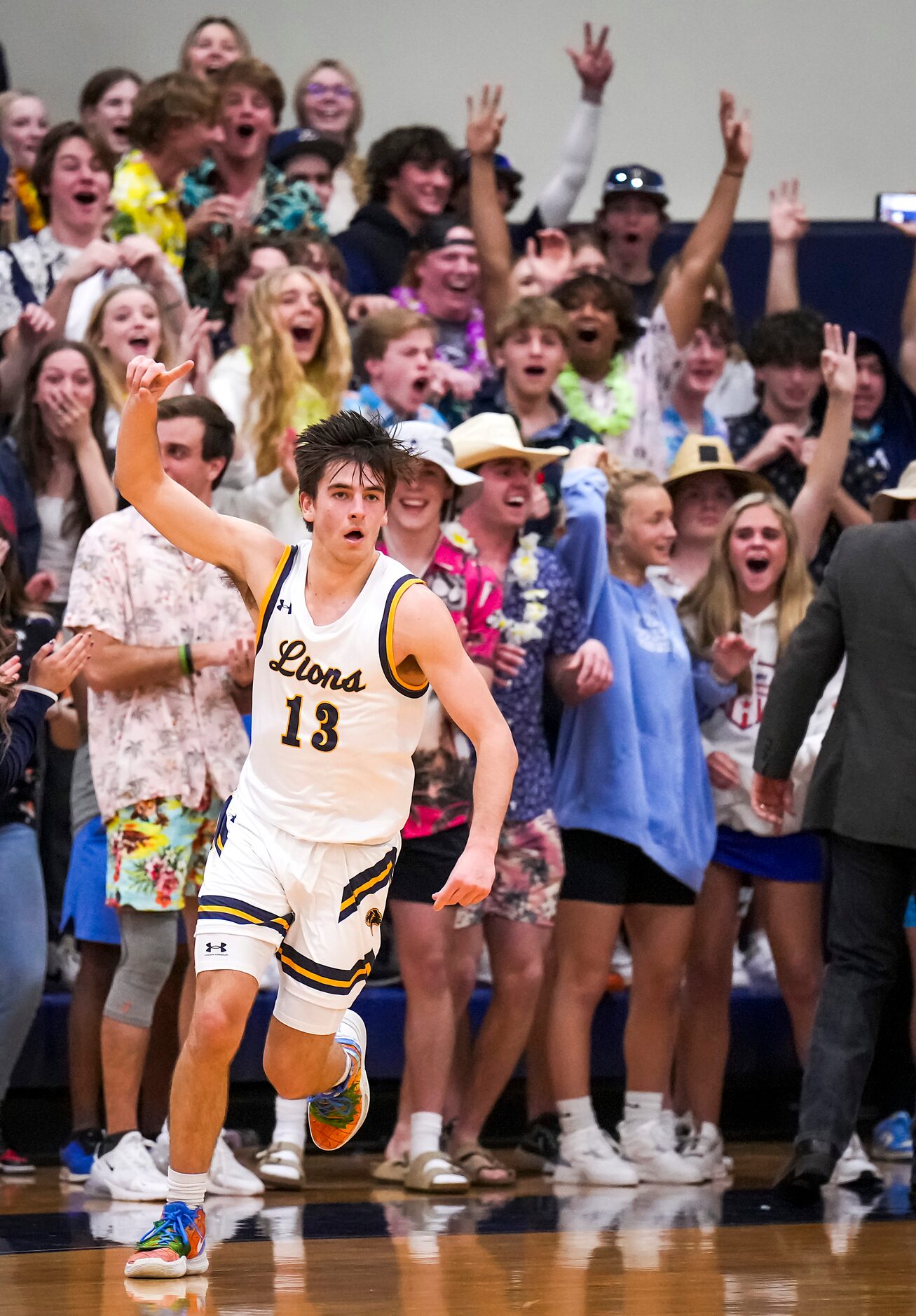 Prestonwood Christian's Jake Murphy (13) celebrates after hitting a 3-pointer at the buzzer...