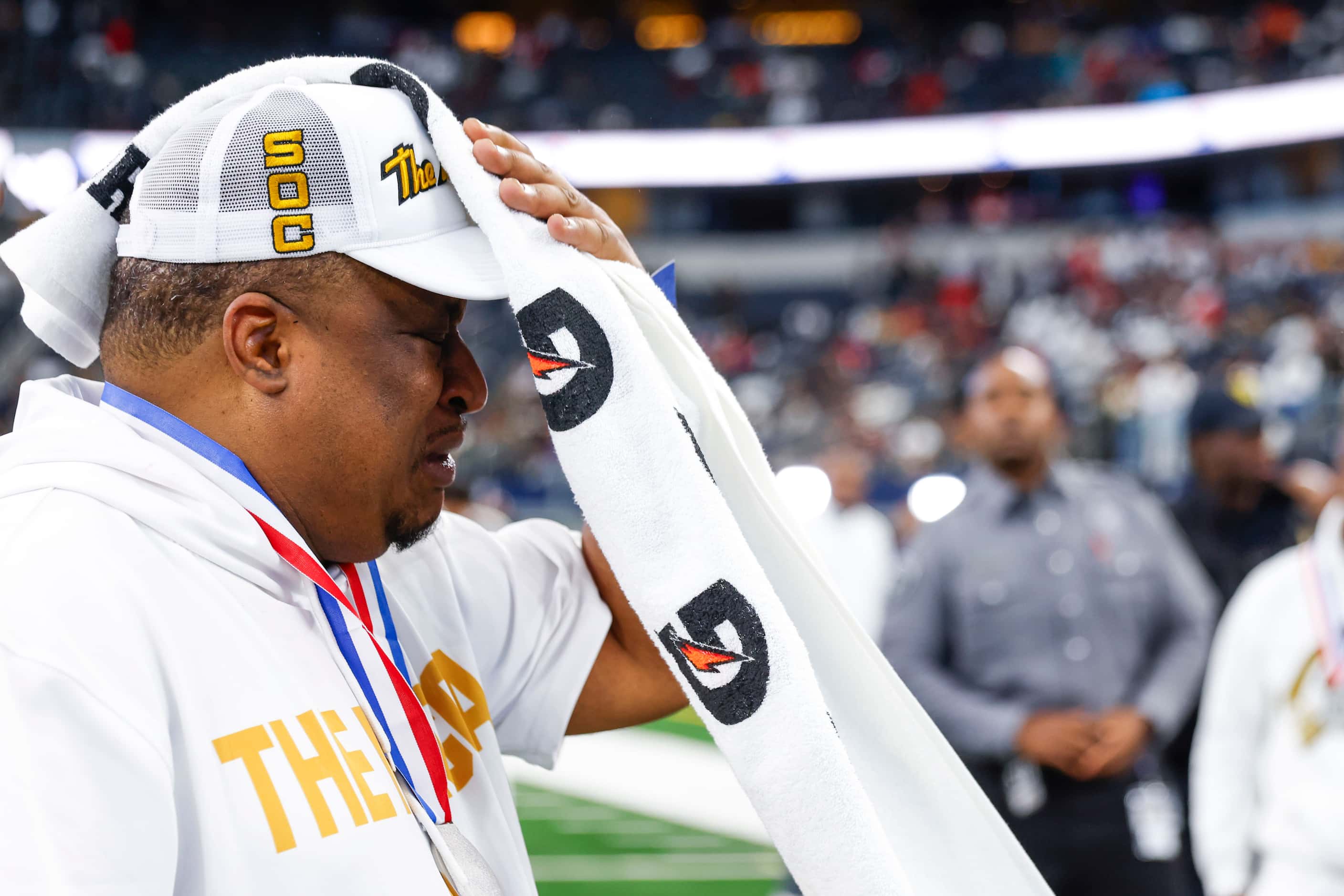 South Oak Cliff head coach Jason Todd becomes emotional  before addressing his following the...
