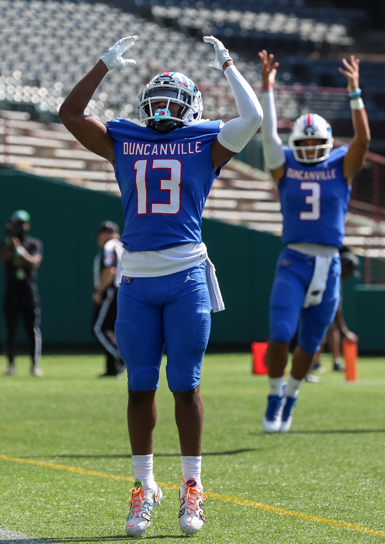 Duncanville wide receiver Roderick Daniels, Jr. (13) celebrates a touchdown with quarterback...