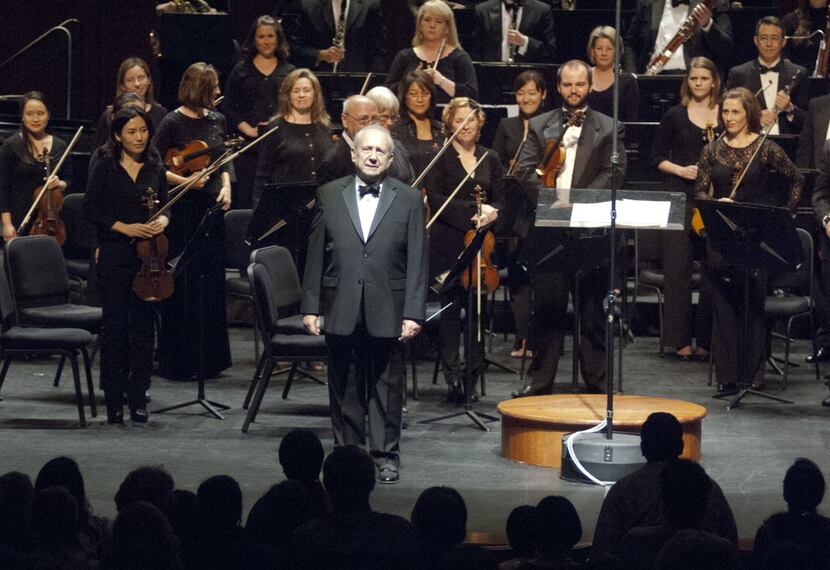 Maestro Anshel Brusilow pauses to acknowledge a standing ovation given him by the Richardson...