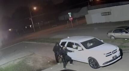 Dallas police released a still image of two men trying to get into a white SUV near where a...