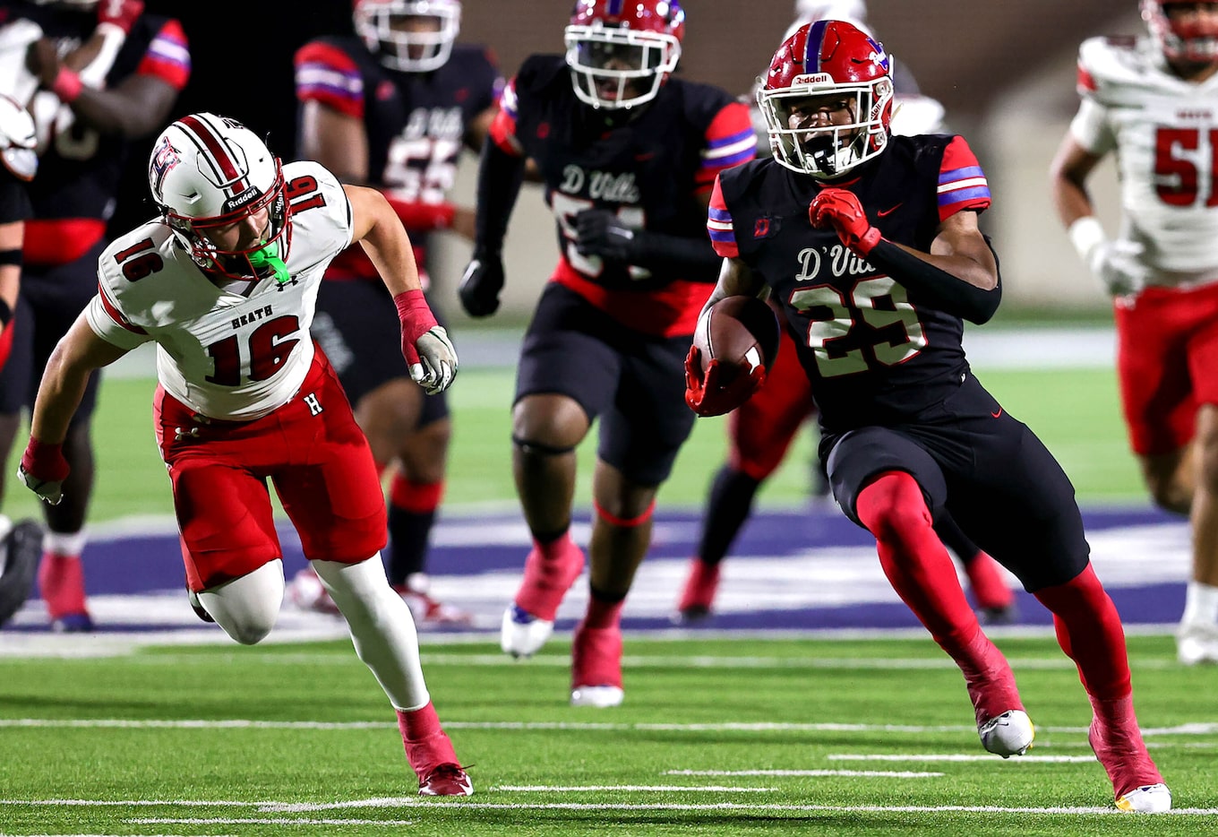 Duncanville running back Caden Durham (29) races past  Rockwall Heath linebacker Brady Luff...