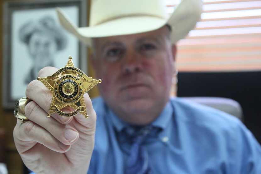 Denton County Sheriff Tracy Murphree holds up the new sheriff's office badge on Wednesday in...