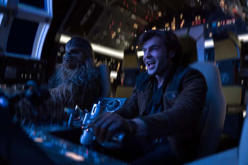 In this image released by Lucasfilm, Alden Ehrenreich, right, and Joonas Suotamo appear in a...
