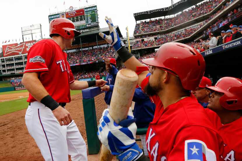 Texas Rangers Rougned Odor (right) congratulates Jared Hoying (31) on his score during the...