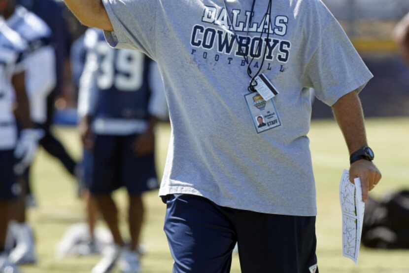 Dallas Cowboys special teams coordinator Joe DeCamillis  directs players during their walk...
