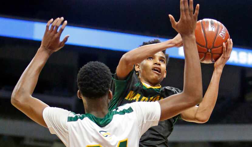 Madison's Jerome Rogers Jr. #11 shoots over San Antonio Cole's Vincent Iwuchukwu #24.  San...