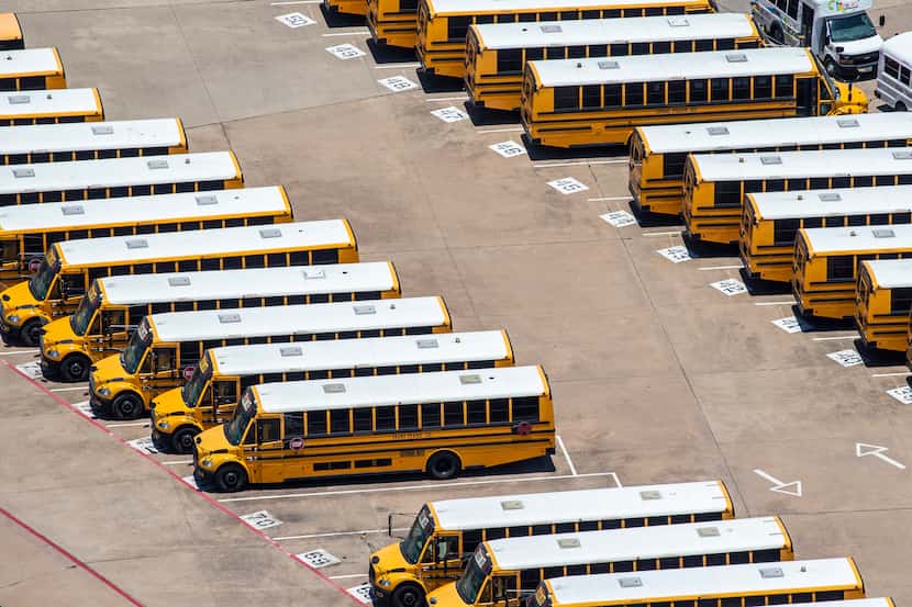 Buses are lined up at the Grand Prairie ISD Maintenance and Operations building in Grand...