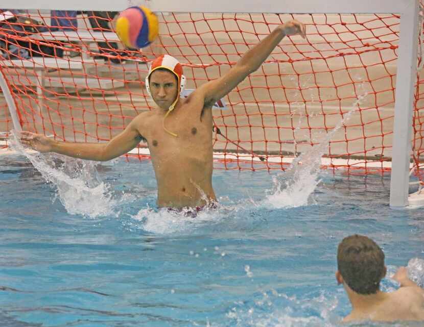 
Goalie TJ Christian tries to block a shot during  practice at the Rockwall ISD Aquatic...