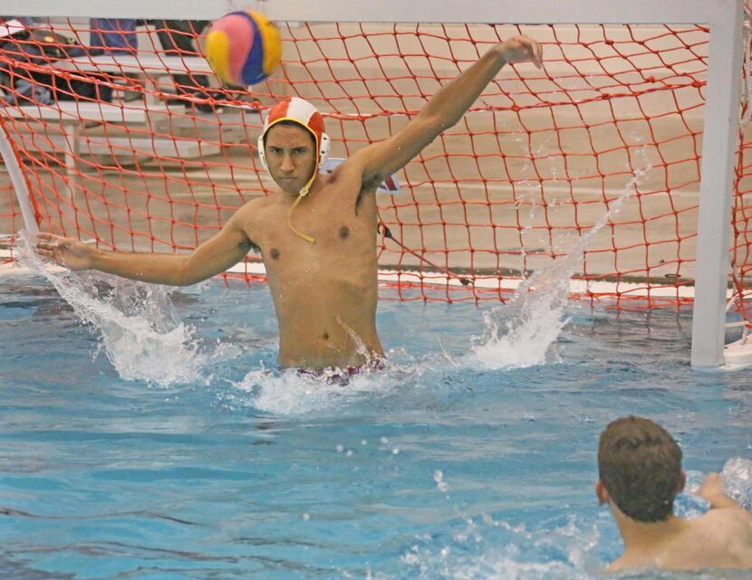 
Goalie TJ Christian tries to block a shot during  practice at the Rockwall ISD Aquatic...