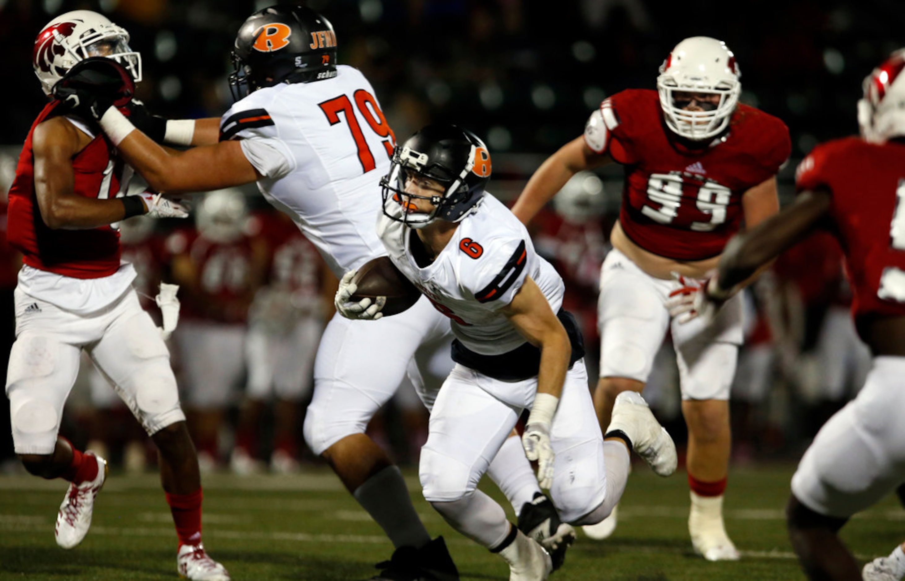 Rockwell's Zach Henry (6) breaks through the Mesquite Horn line in route to a touchdown, as...