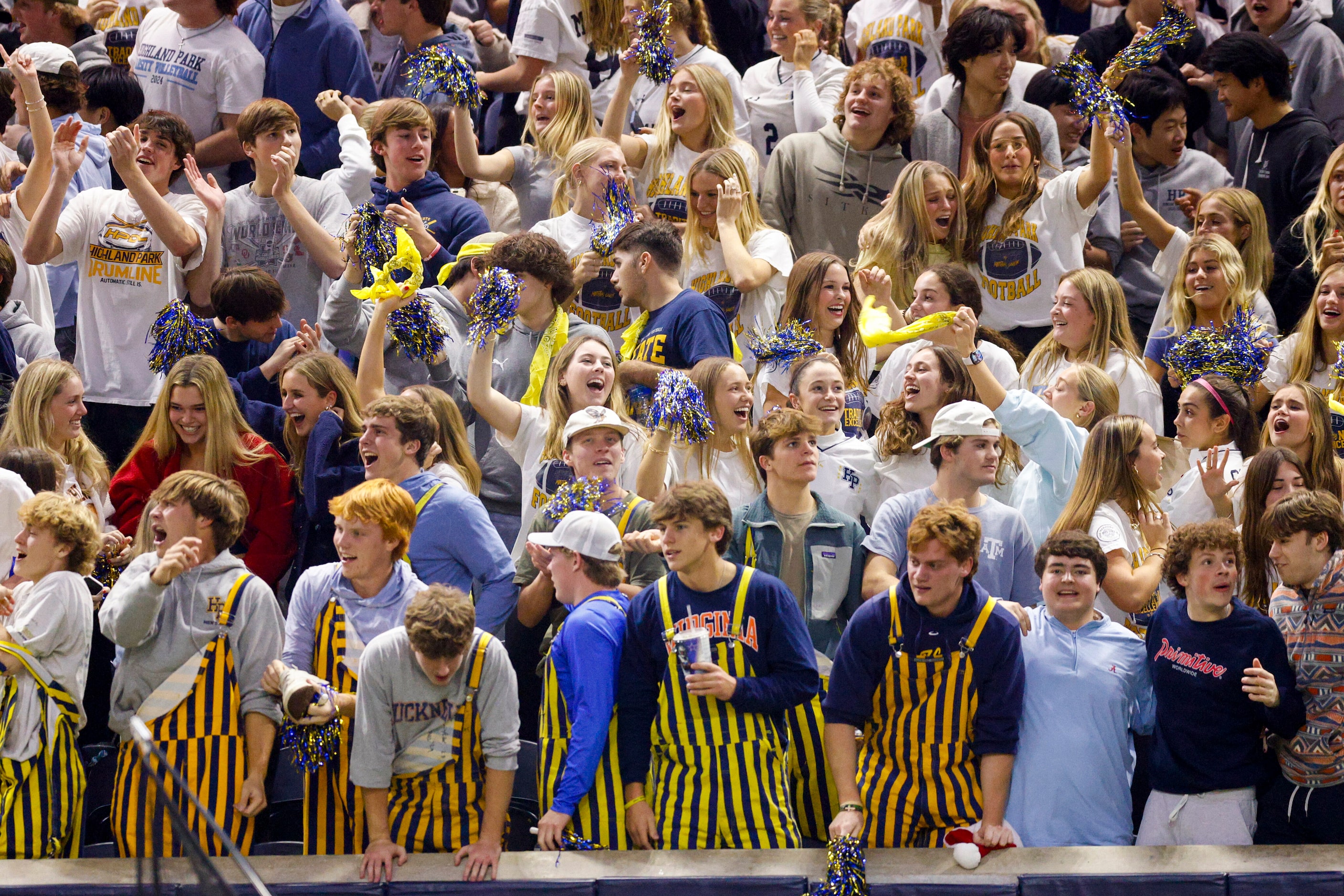 Highland Park students celebrate a touchdown during the second half of a Class 5A Division I...