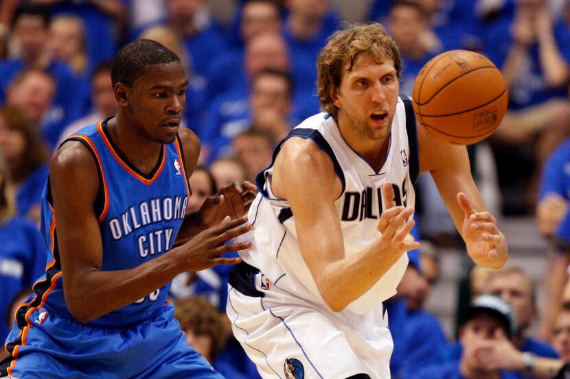 Dallas Mavericks power forward Dirk Nowitzki (41) receives the ball as he is defended by...