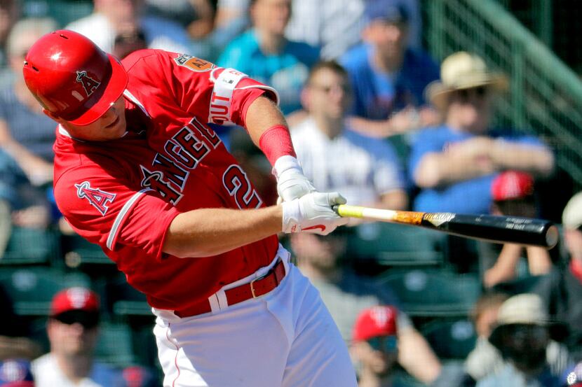 Los Angeles Angels' Mike Trout follows through on a double during the second inning of a...