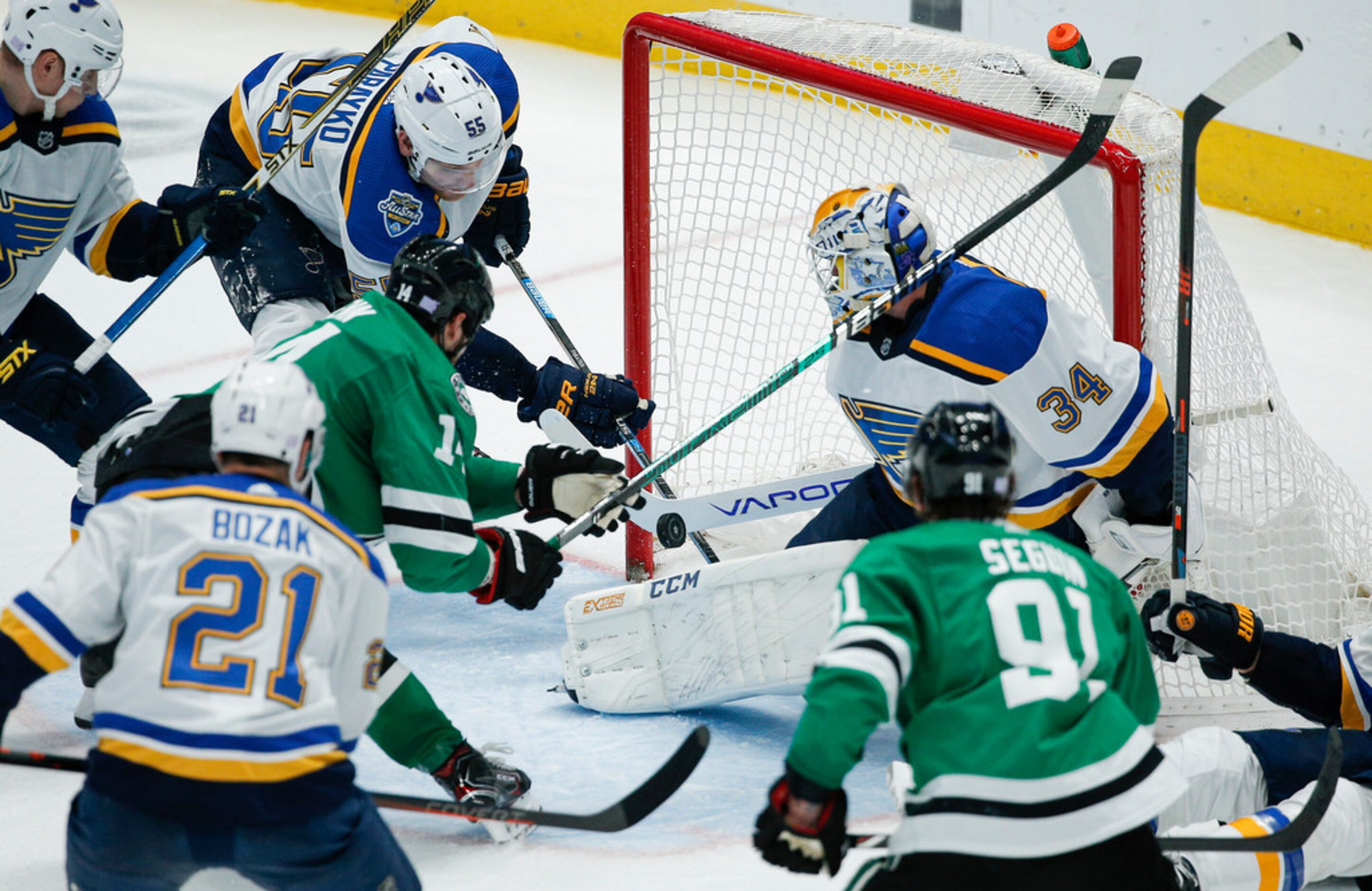 St. Louis Blues goaltender Jake Allen (34) blocks a shot from Dallas Stars forward Jamie...