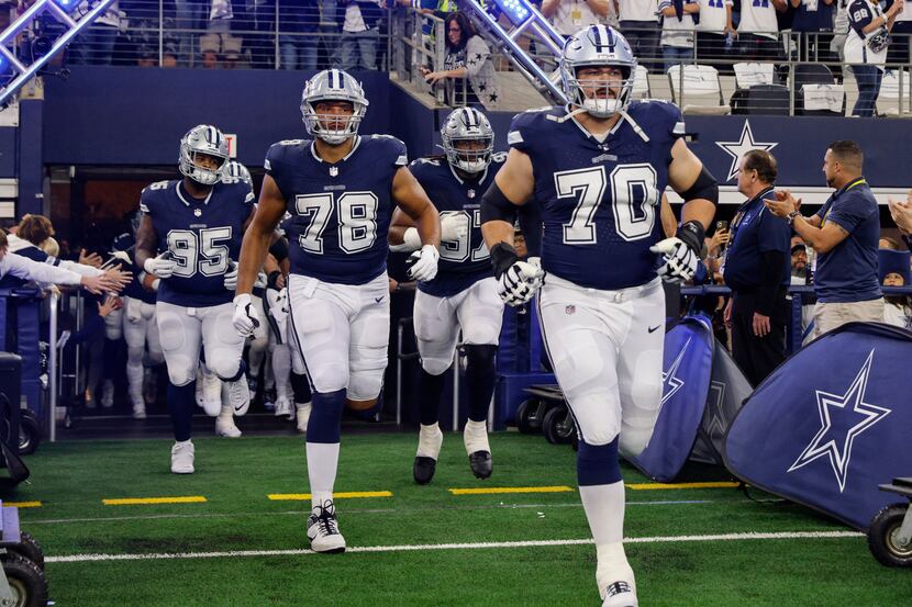 Dallas Cowboys guard Zack Martin (70) and offensive tackle Terence Steele (78) lead the team...