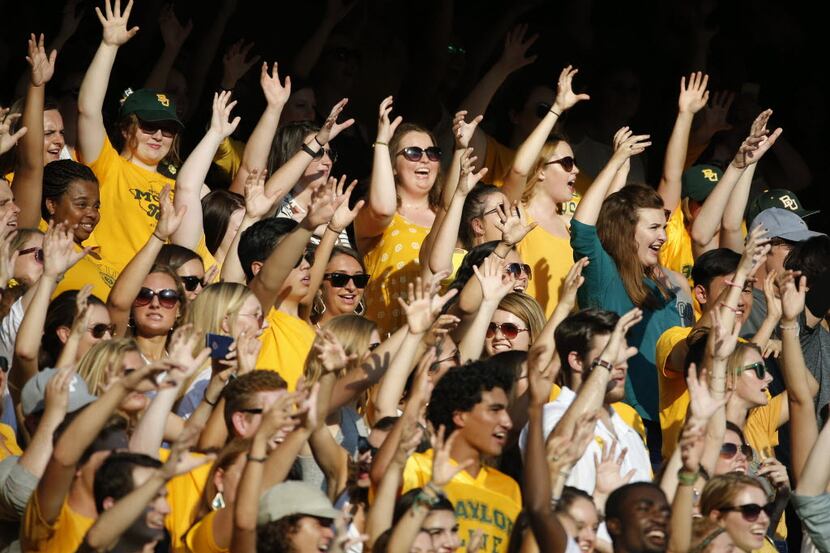 Baylor students do the "Bear Claw" in the stands during the Northwestern State University...