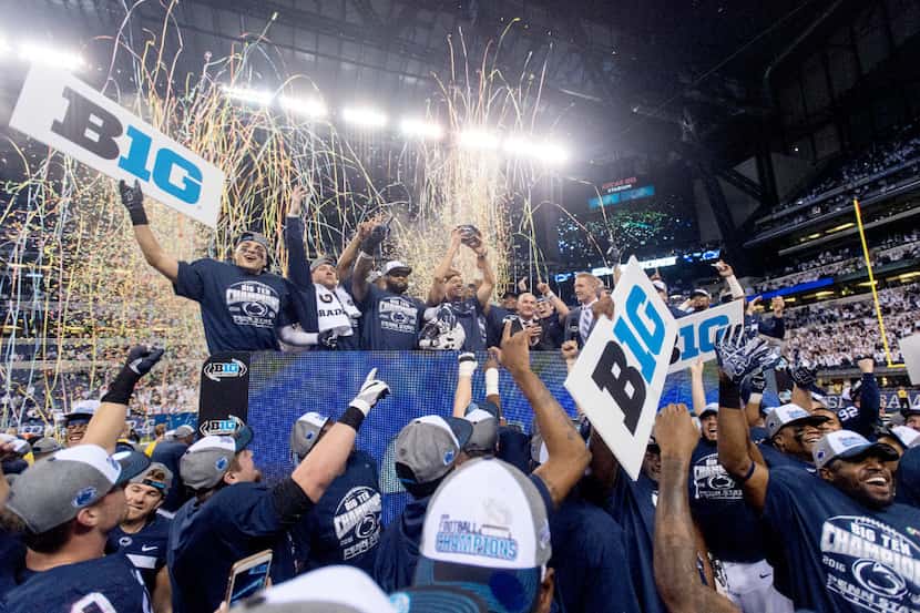 Penn State celebrates after a 38-31 win over Wisconsin in the Big Ten championship NCAA...
