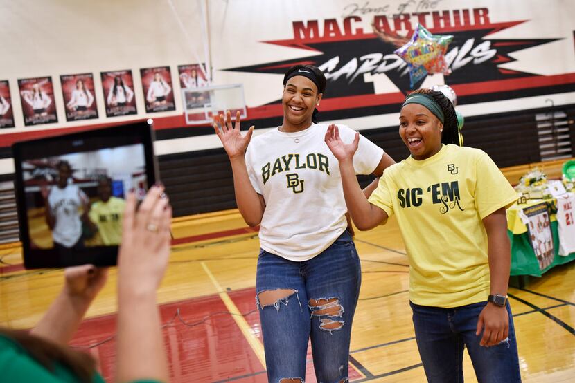 Irving MacArthur girls basketball players Hannah Gusters, left, and Sarah Andrews, make the...