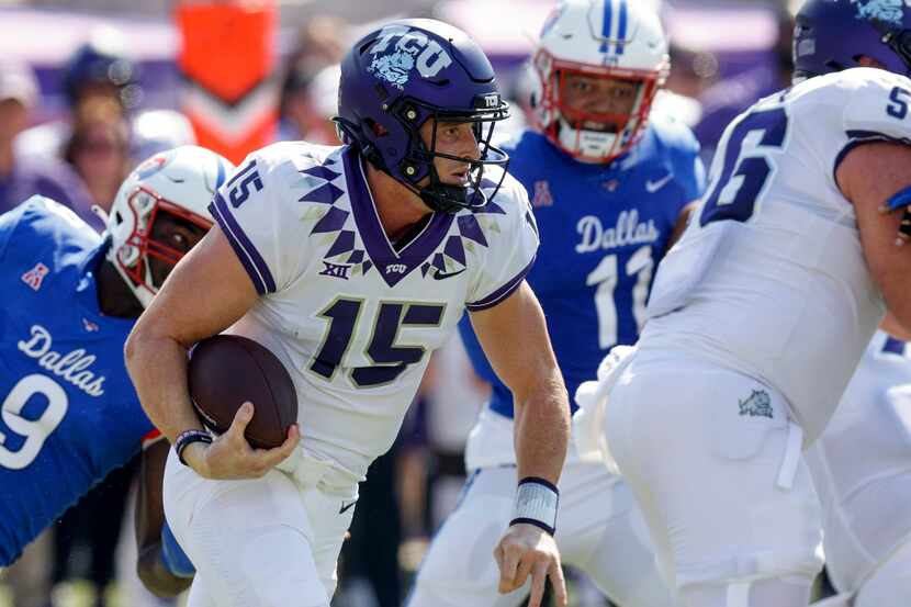 TCU quarterback Max Duggan (15) runs the ball as his pursued by SMU defensive end Nelson...