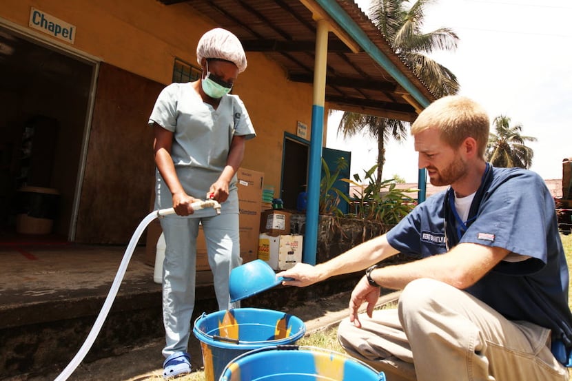 Dr. Kent Brantly, an American who contracted Ebola, works at an Ebola isolation ward at a...