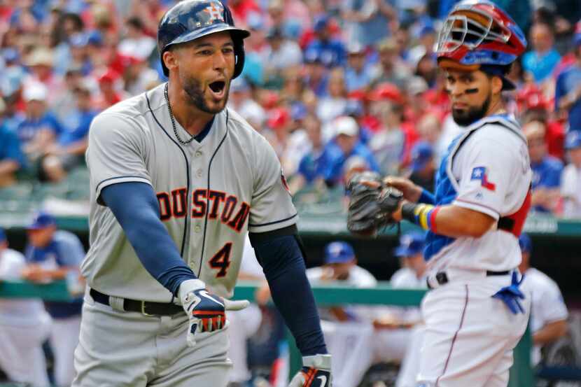 Houston Astros George Springer celebrates after his first inning home run as Texas Rangers...