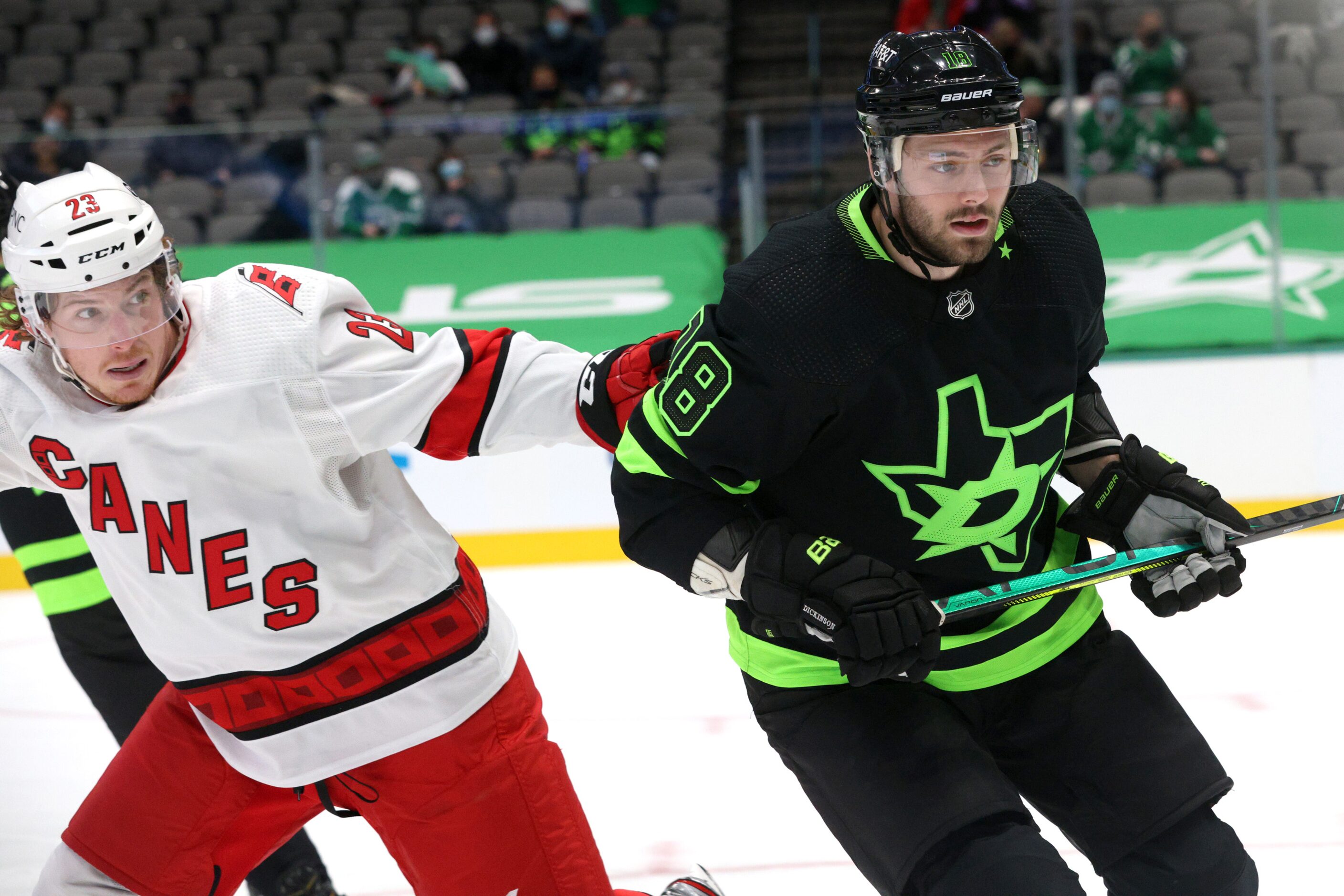 Dallas Stars center Jason Dickinson (18) defends against Carolina Hurricanes left wing Brock...