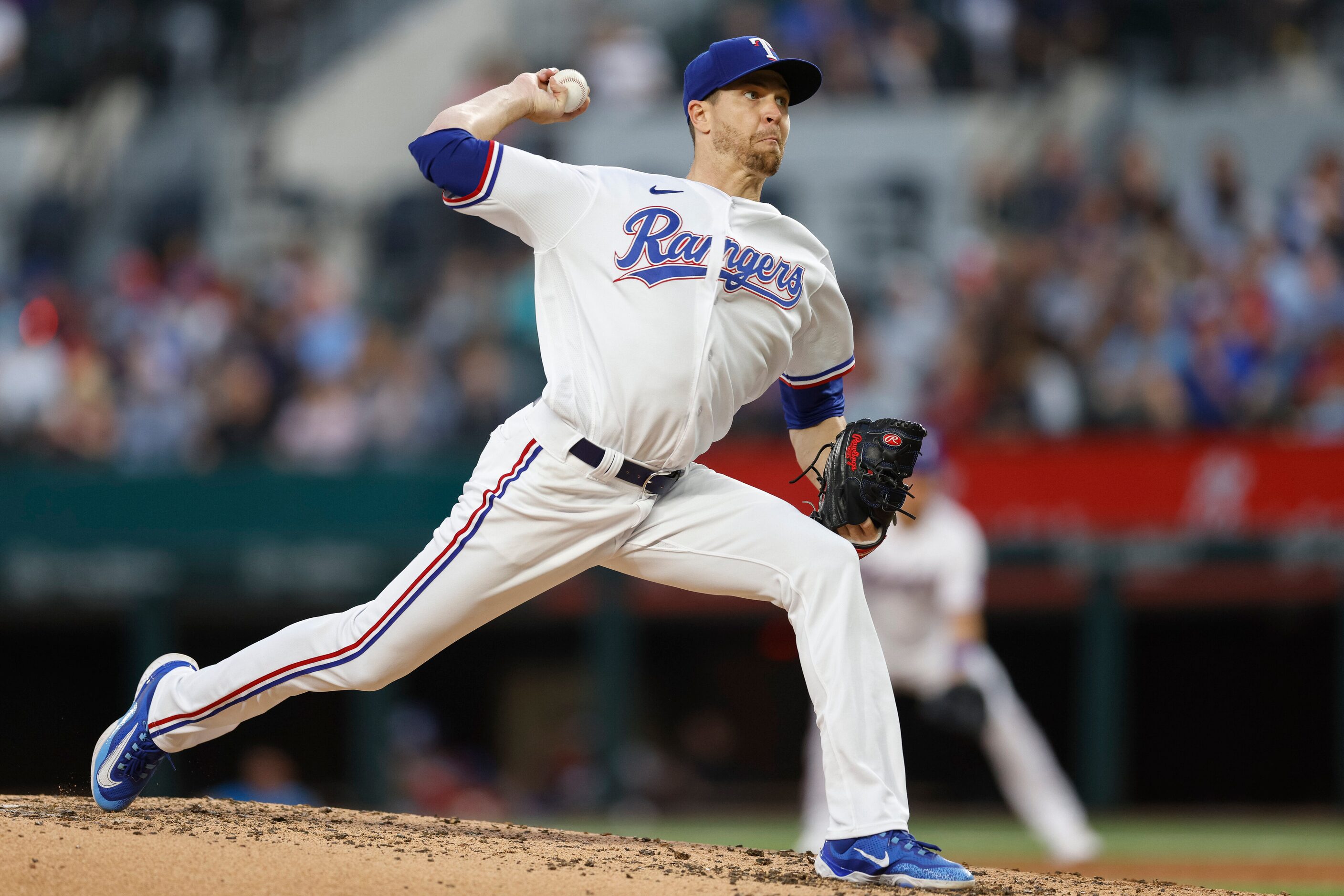 Texas Rangers starting pitcher Jacob deGrom (48) delivers a pitch during the third inning of...