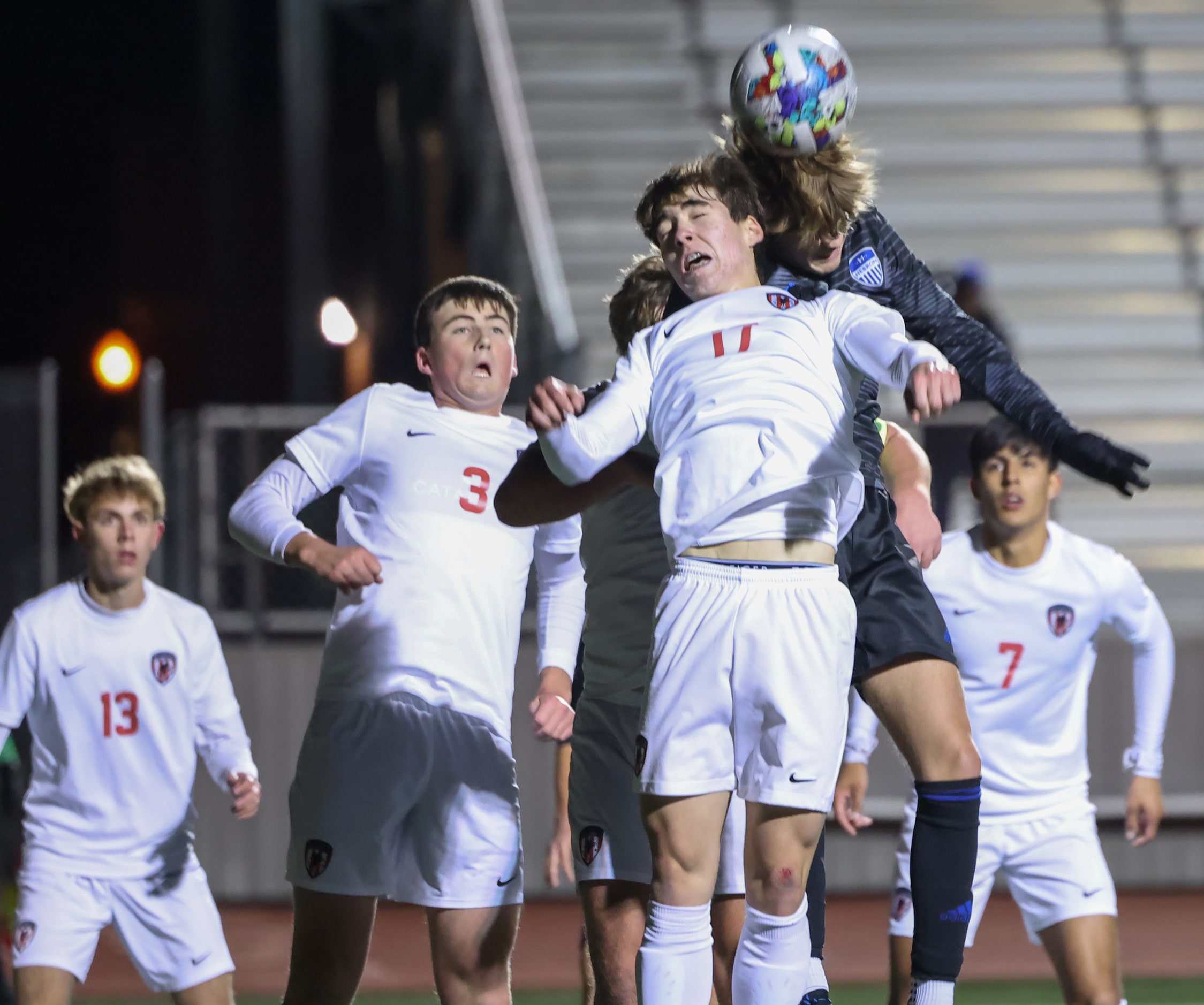 Flower Mound Marcus’ Artian Rifati (17) and Hebron’s Mason Hately (8) make contact as they...