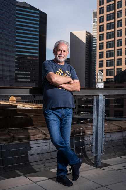 Mike Rhyner, photographed on the rooftop of The Wilson building, walks downtown's streets...