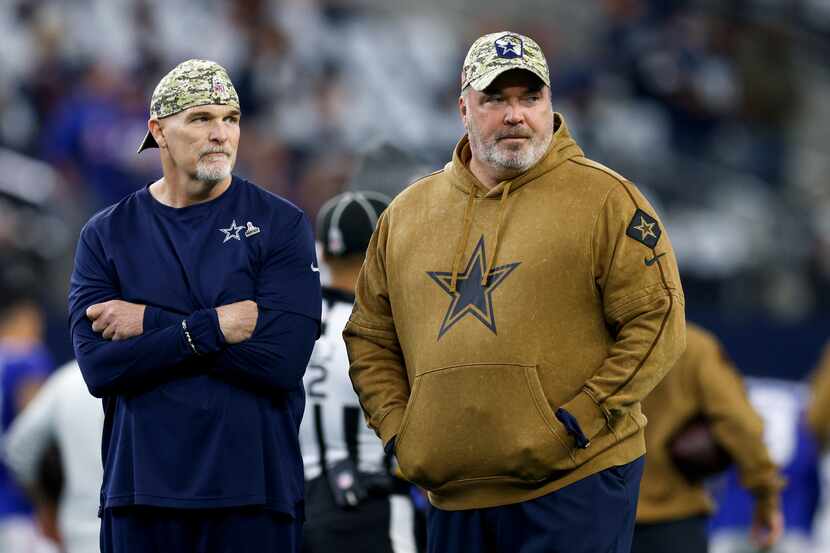 Dallas Cowboys defensive coordinator Dan Quinn (left) and head coach Mike McCarthy watch...