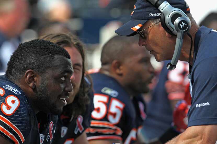 Henry Melton (69) of the Chicago Bears listens to defensive coordinator Rod Marinelli during...