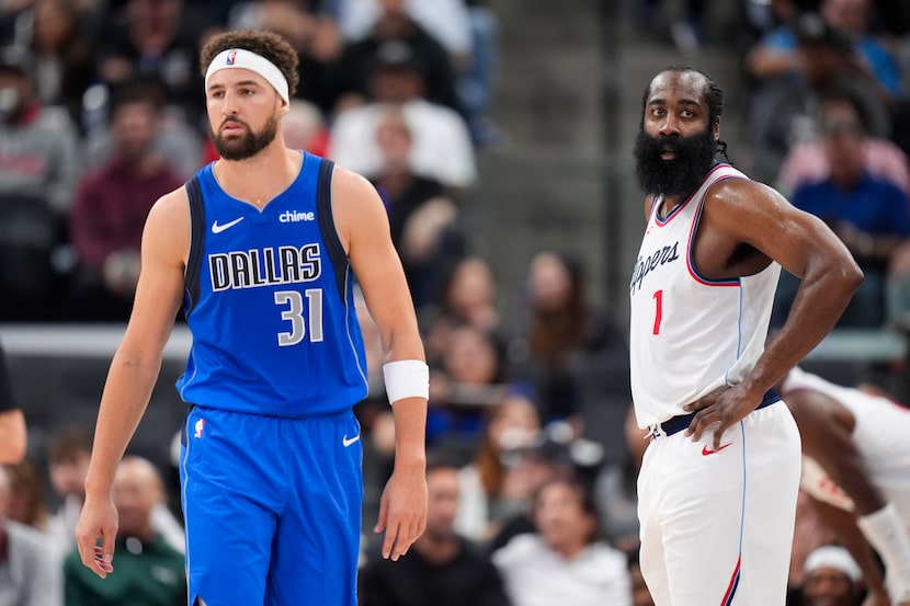 Dallas Mavericks' Klay Thompson (31) walks past Los Angeles Clippers' James Harden (1)...