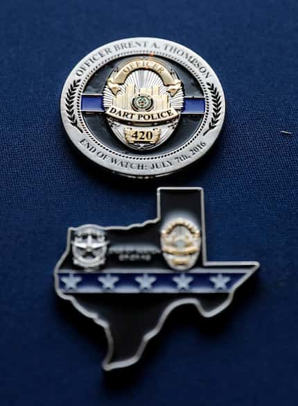 DART Officer Joseph Kyser carries a challenge medal depicting a badge of fallen DART Officer...